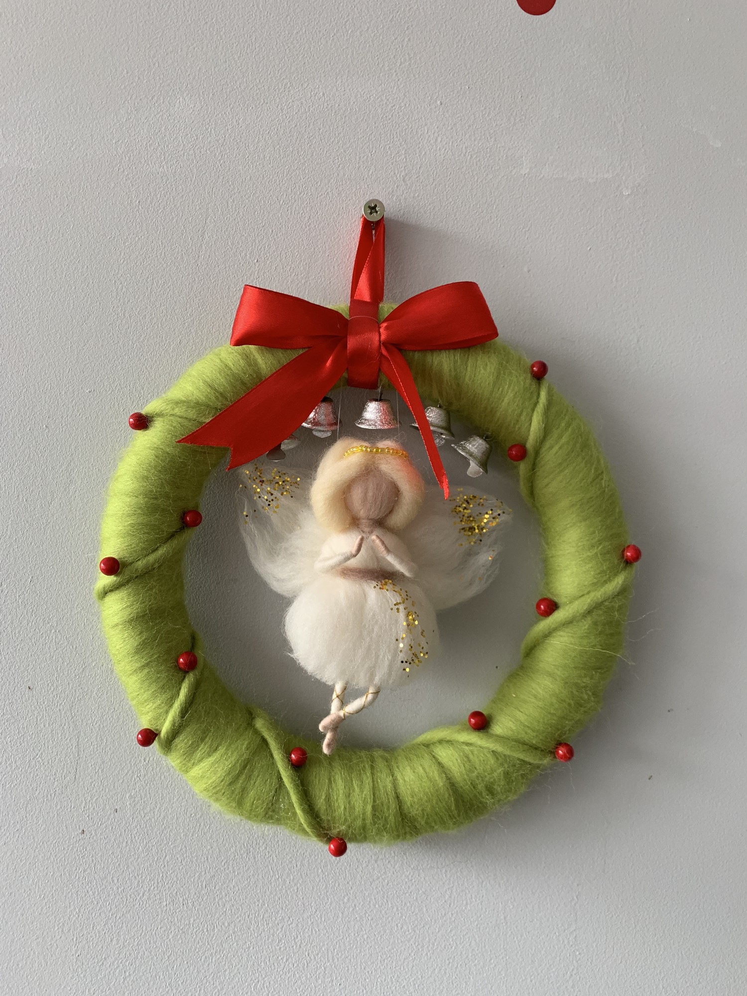 Wreath on the door, decoration for the New Year and Christmas, decor with an angel, New Year's and Christmas decor