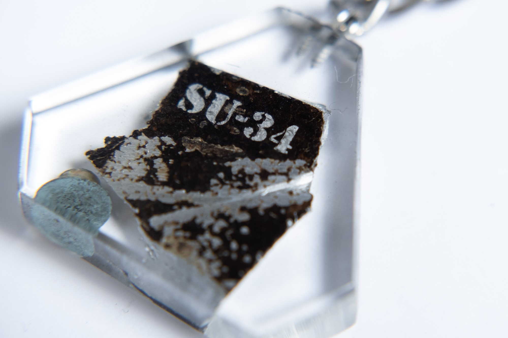 Keyring with a piece of taken down russian su-34 aircraft