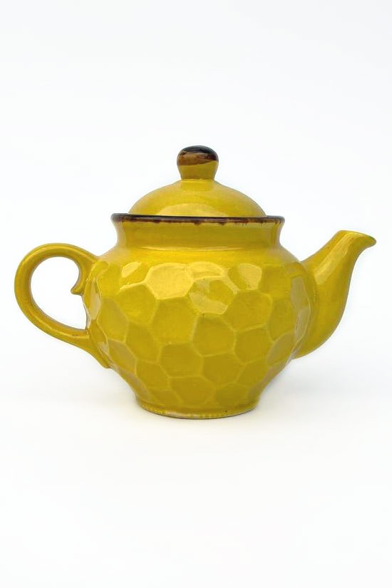 Handmade yellow ceramic teapot