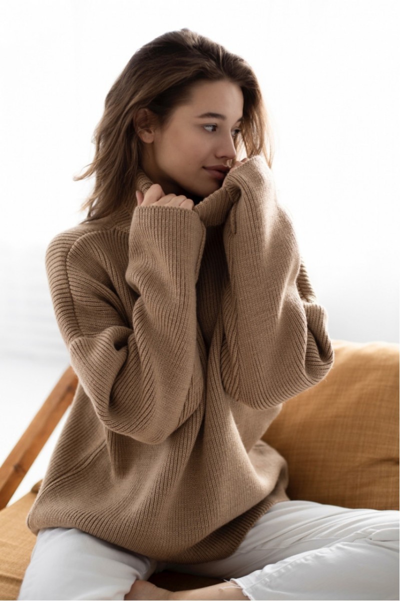 Warm woolen sweater of light brown color