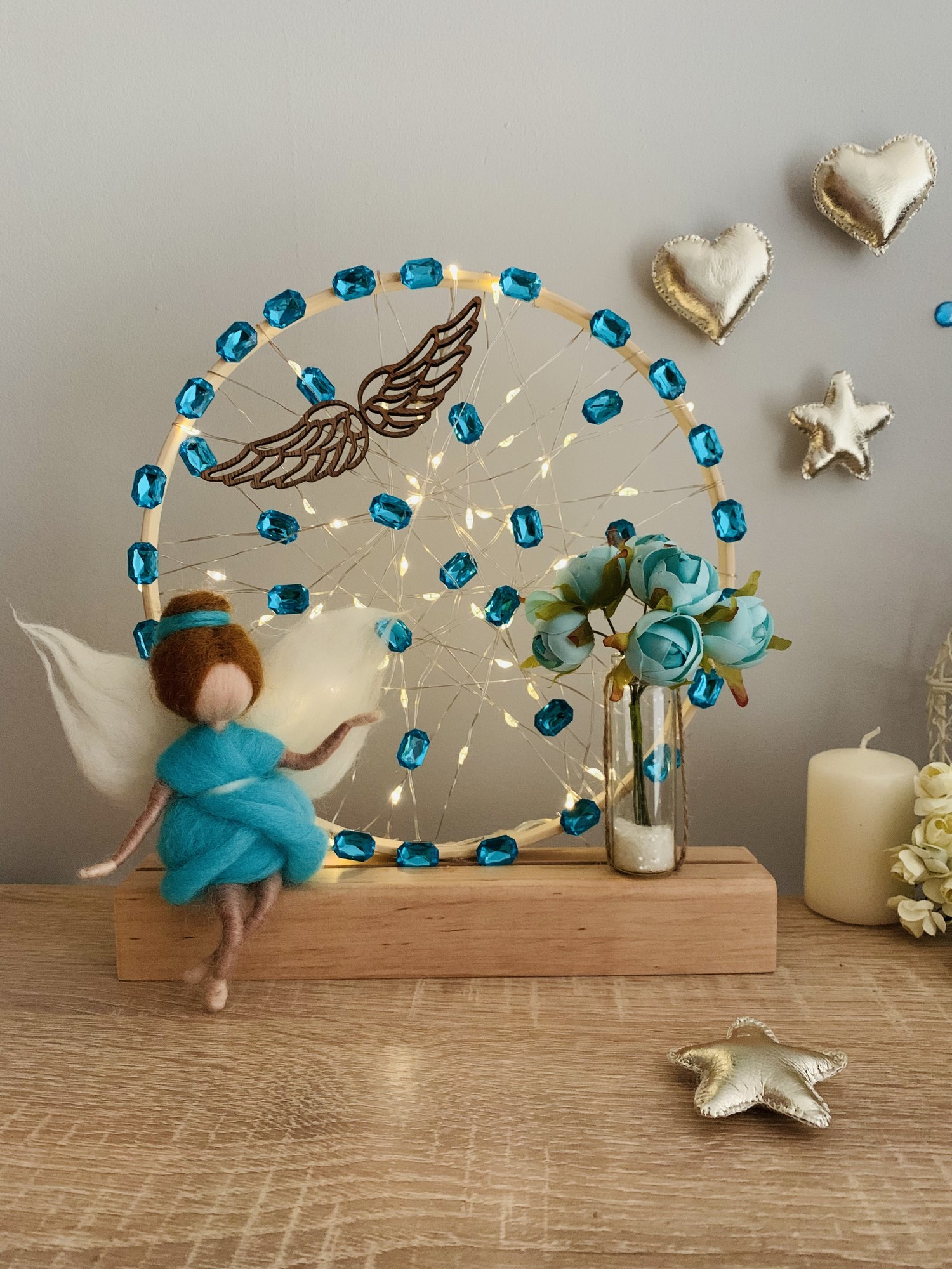 A lamp with a blue angel and flowers, room decor, room lighting