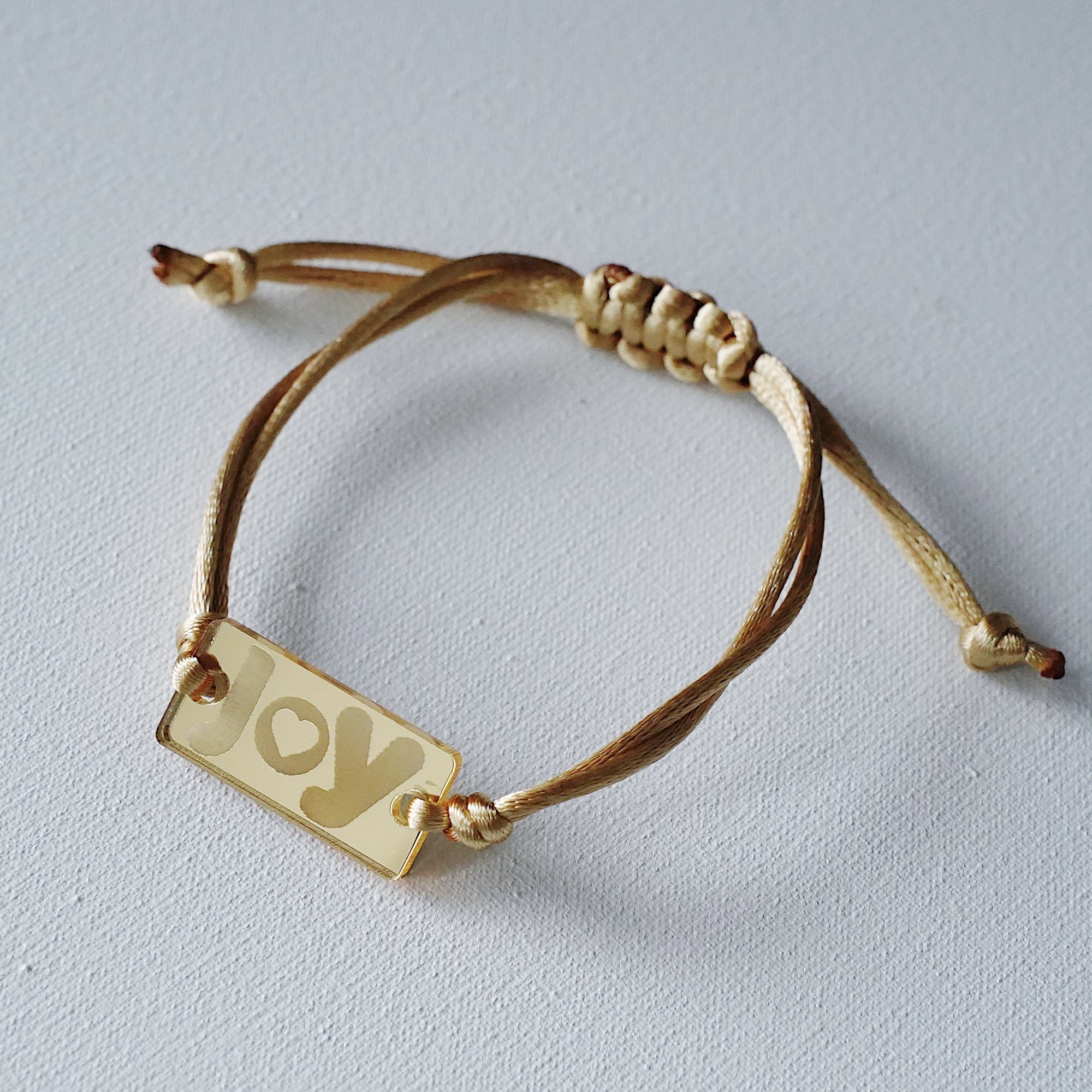 Bracelet "JOY" by ARNO on a silk cord
