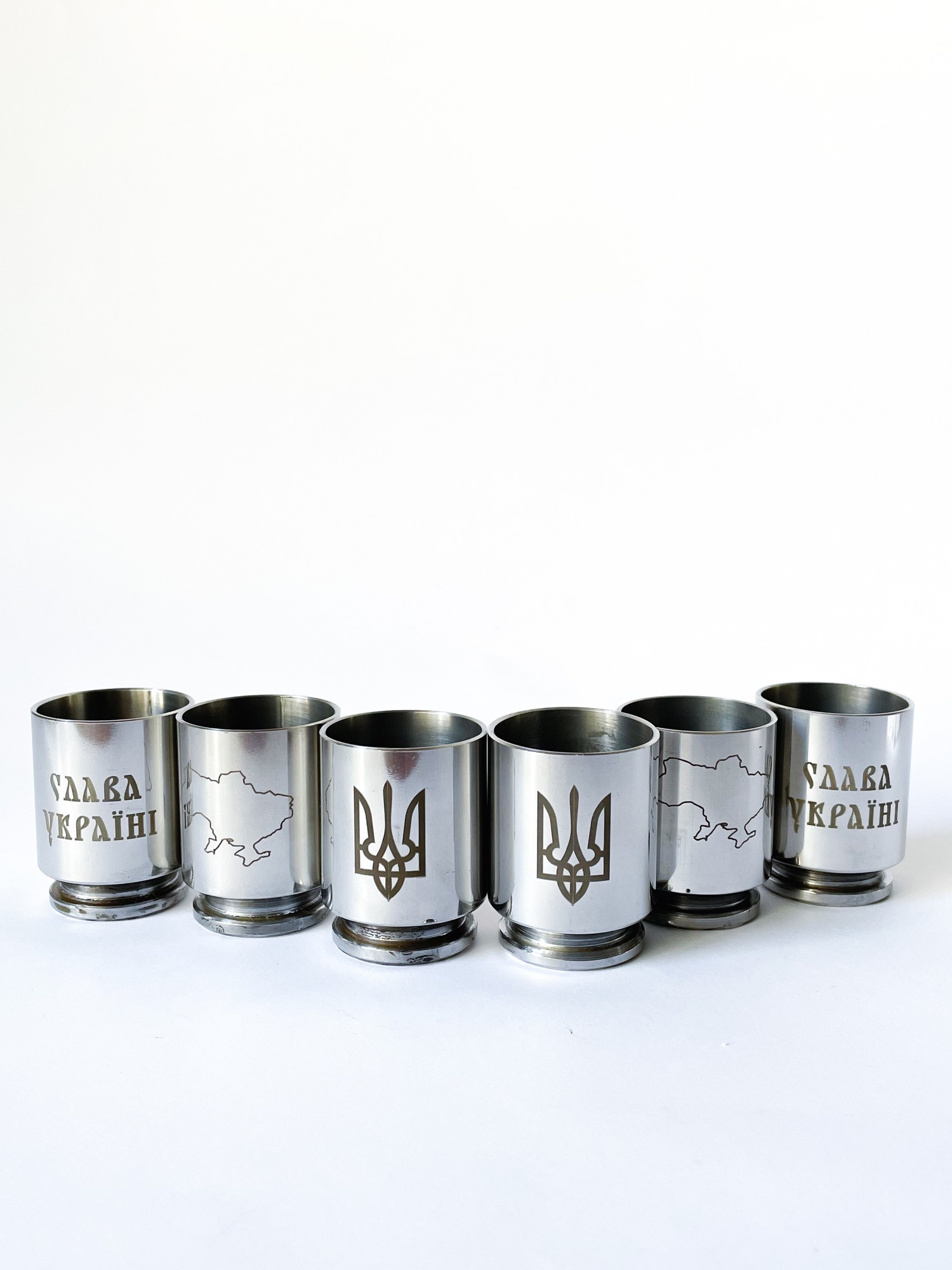 Shot glasses for alcohol made from a spent combat cartridge case