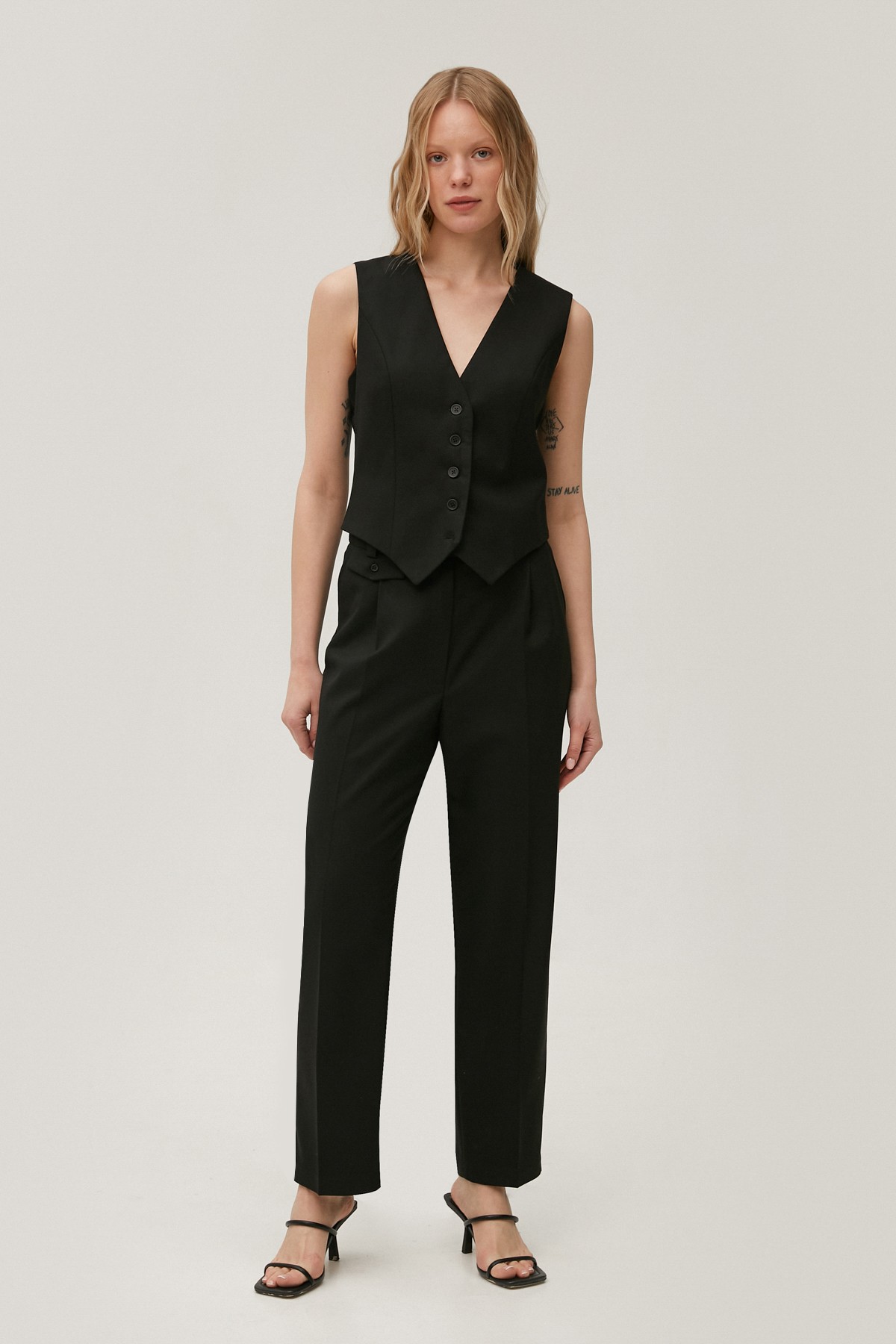 Tapered black pants made of suiting fabric with wool