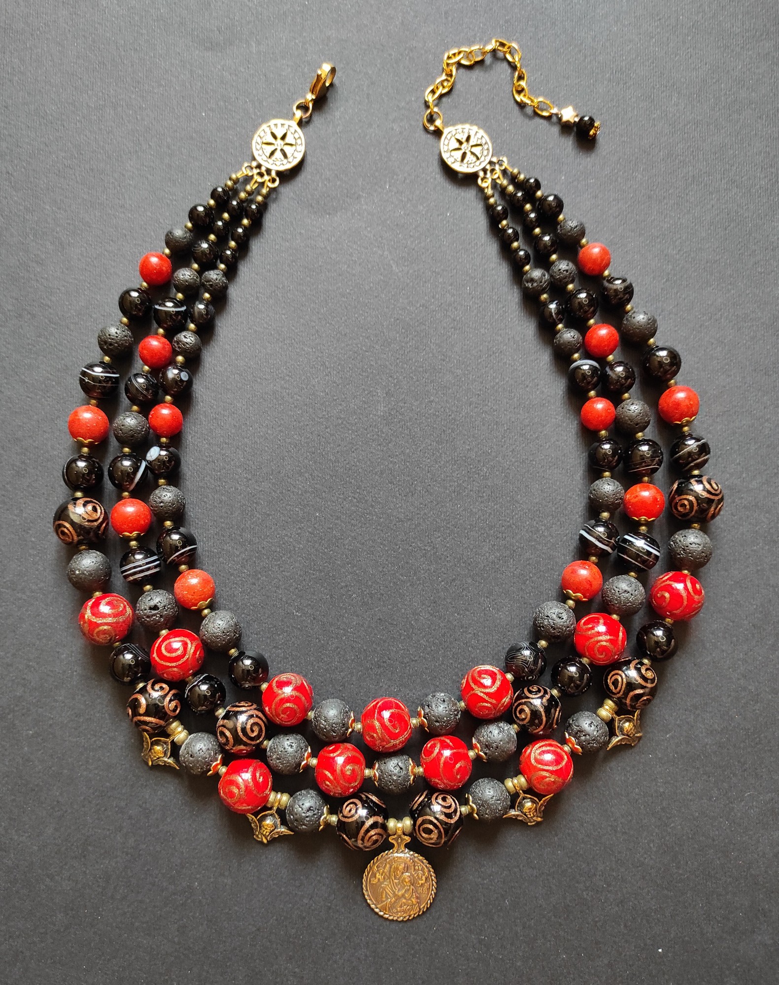 Necklace "Ukrainian indestructibility" from glass beads, agate, lava and coral