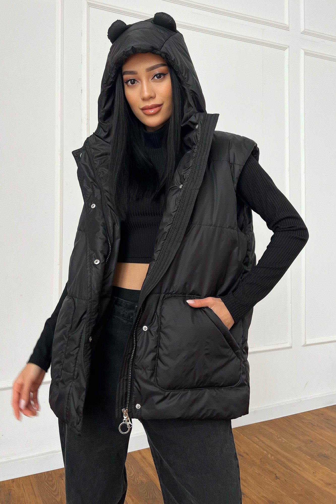 Long vest with a hood in black