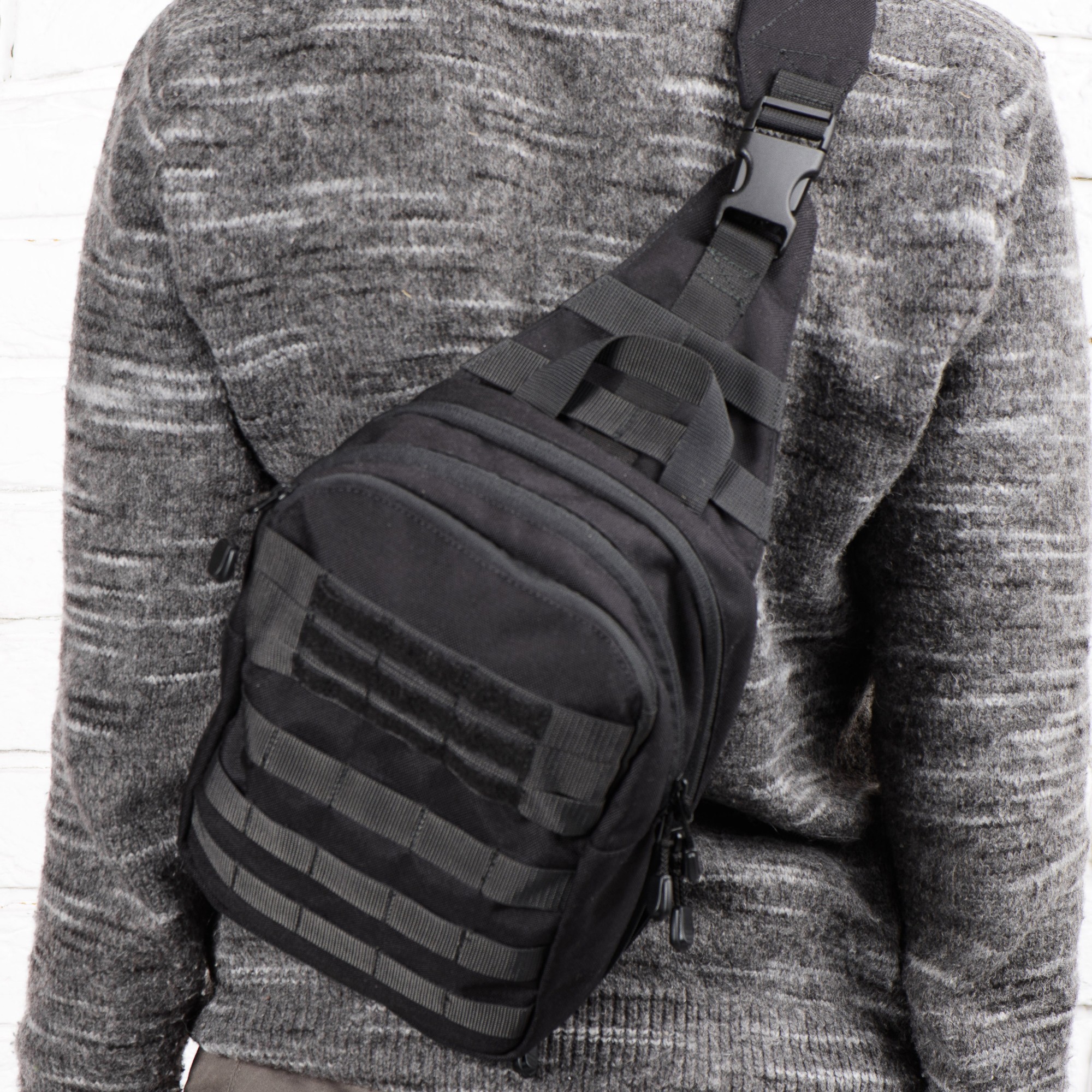 Black single-strap mini backpack