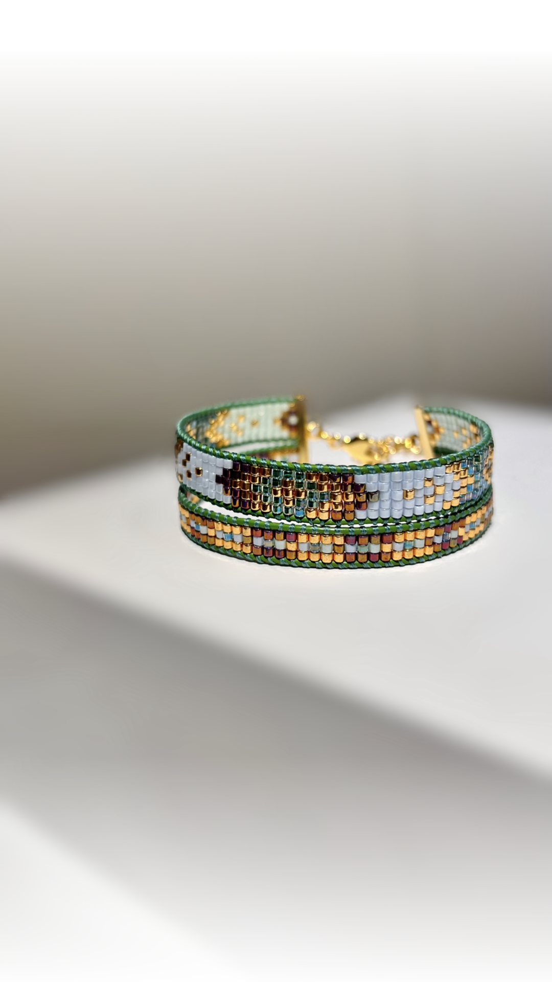 Double bracelet Emerald in green, blue shades with gold and bronze.