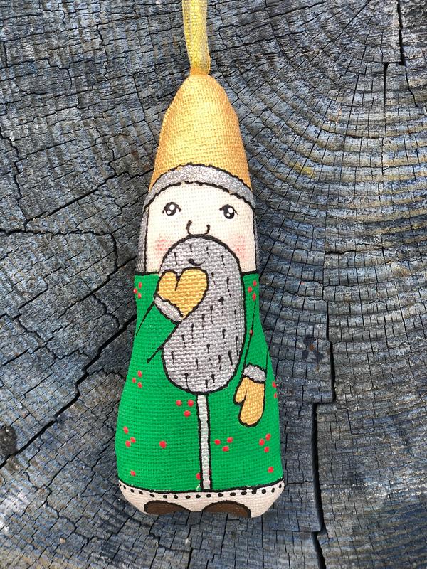 Handmade toy dwarf in a yellow hat