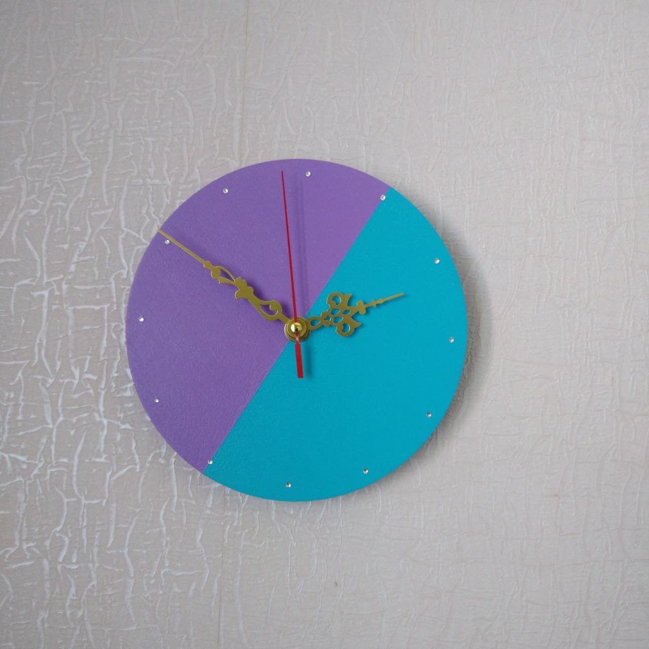 Wall clock delicate two-tone with rhinestones instead of a dial