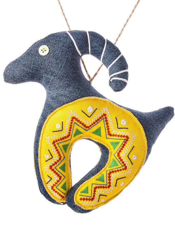 Denim goat with a yellow embroidered horseshoe