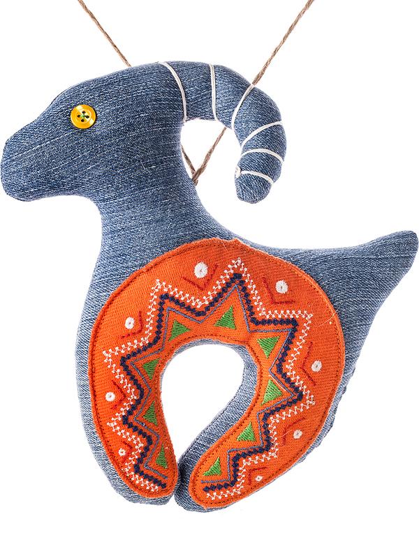 Denim goat with an orange embroidered horseshoe