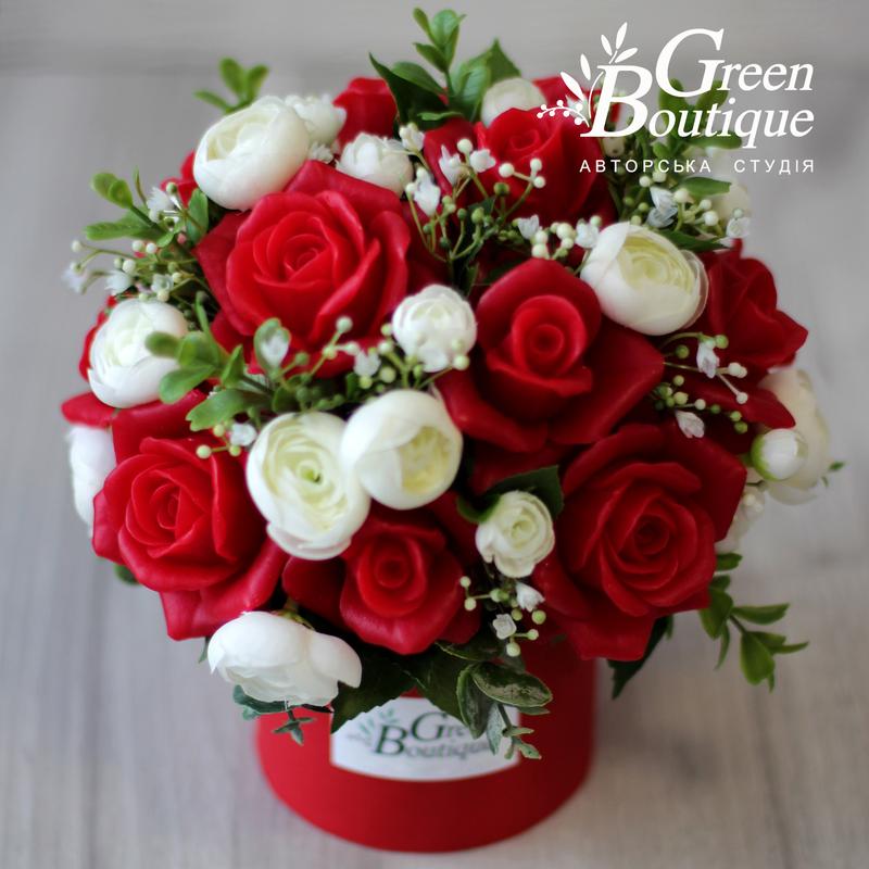 Luxurious interior bouquet of red soap roses in a handmade hat box