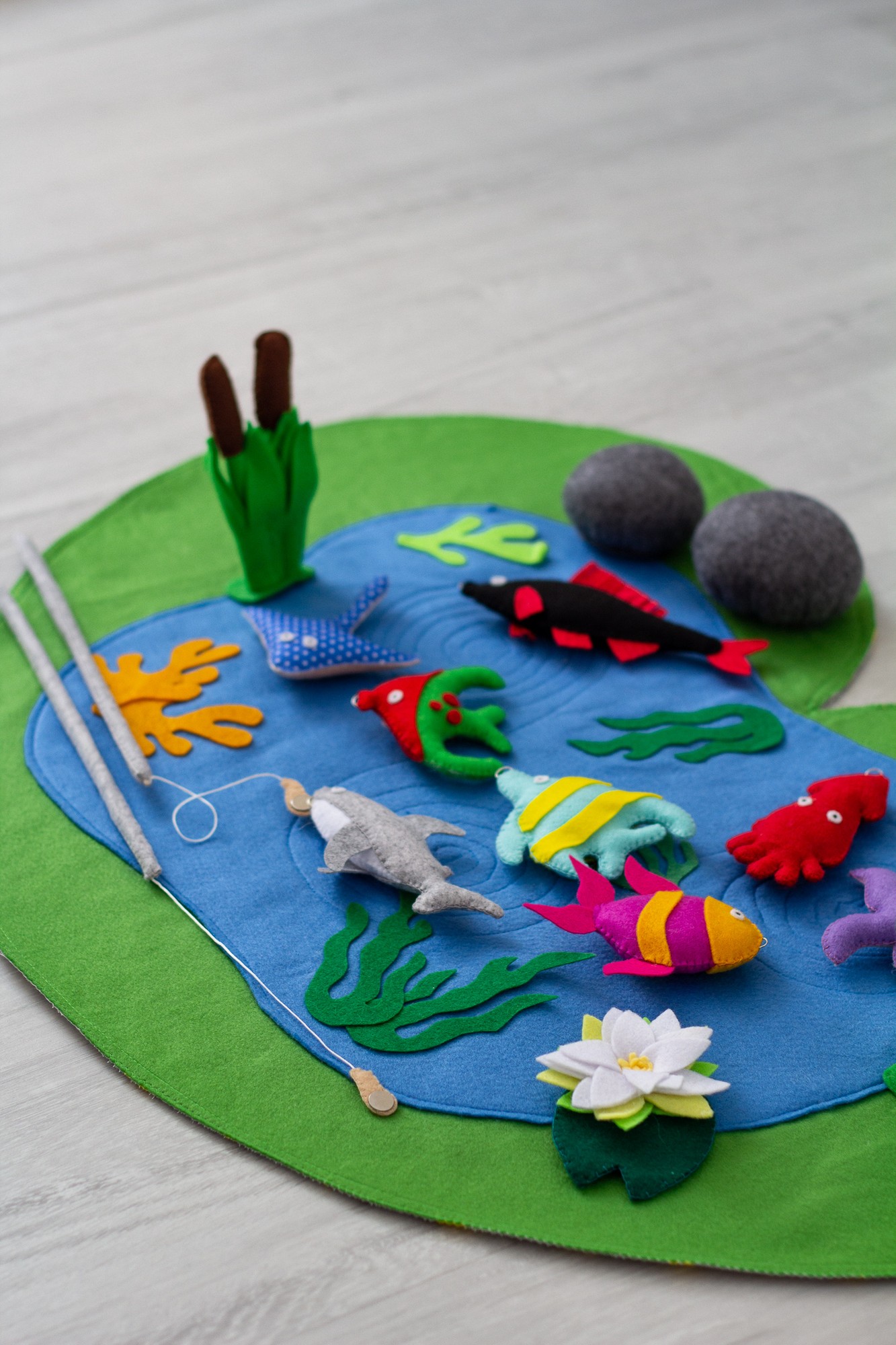 Toddler fish game with fishing pole